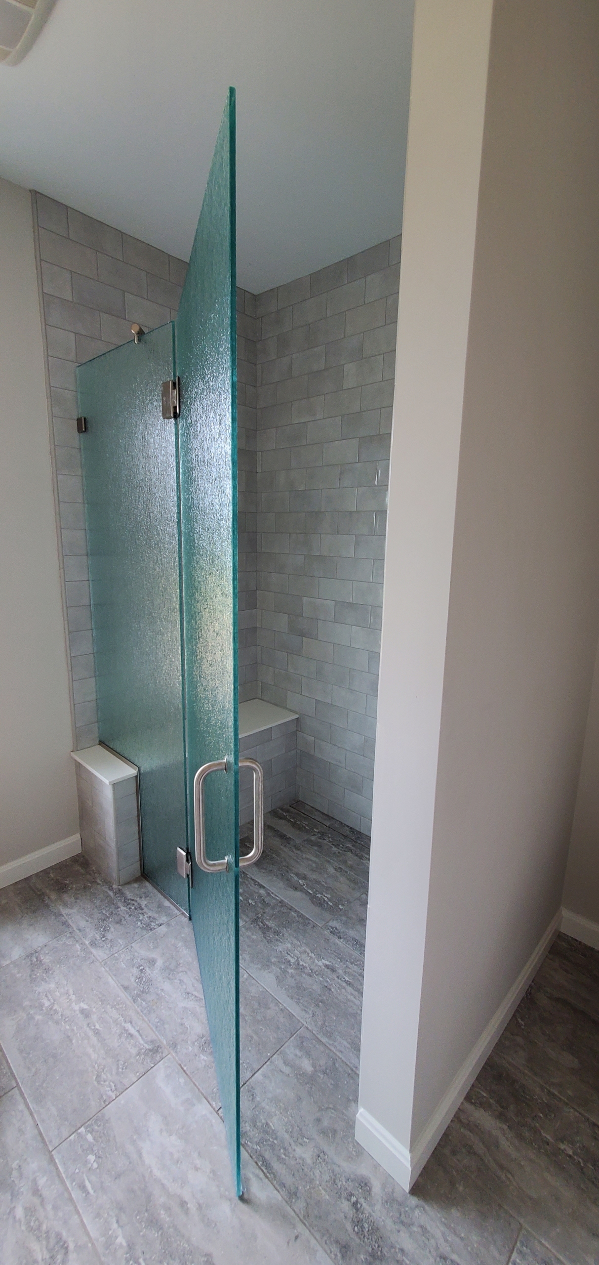 Glass shower door and tile shower