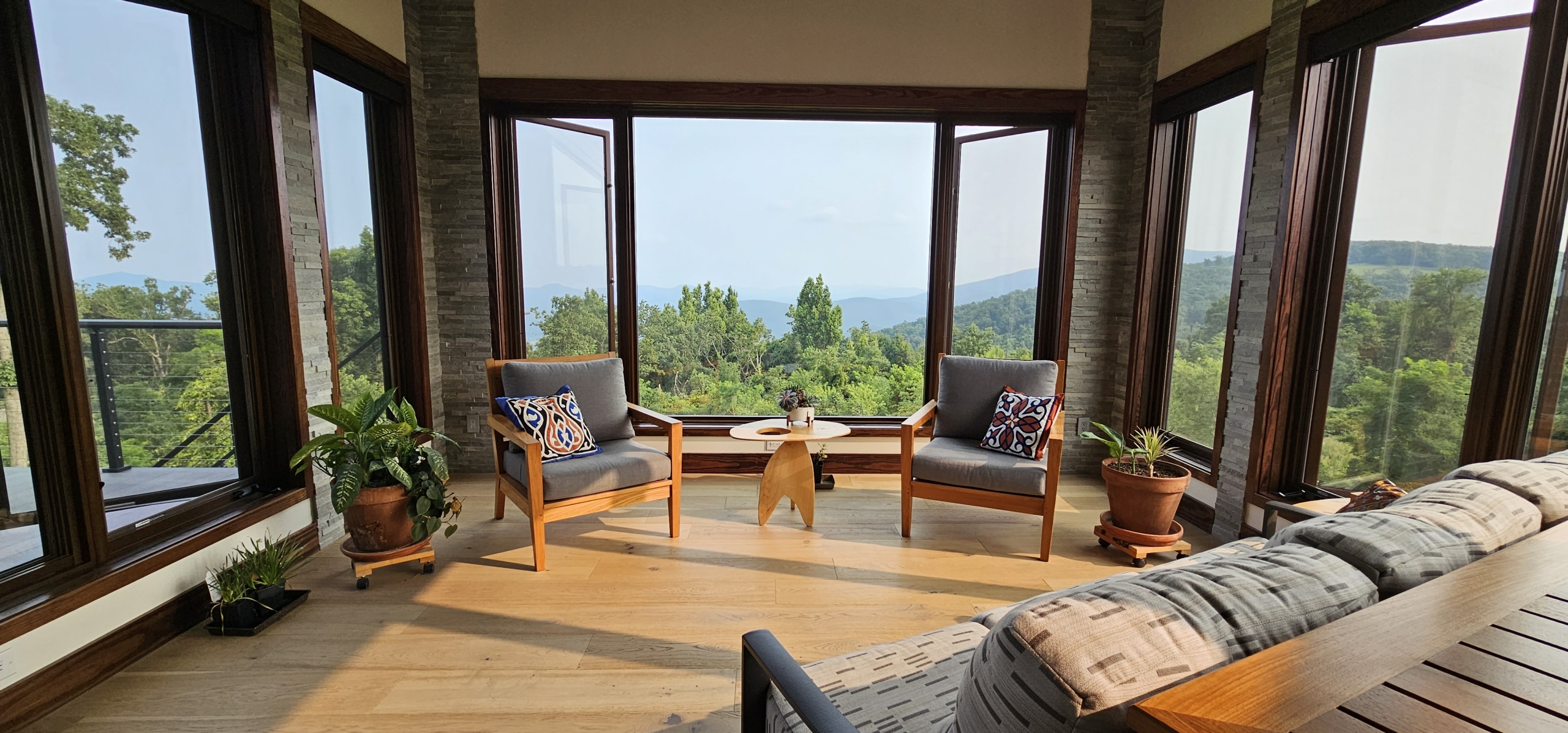 custom home sunroom with view looking off into mountains