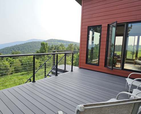 custom home exterior composite deck with view into mountains