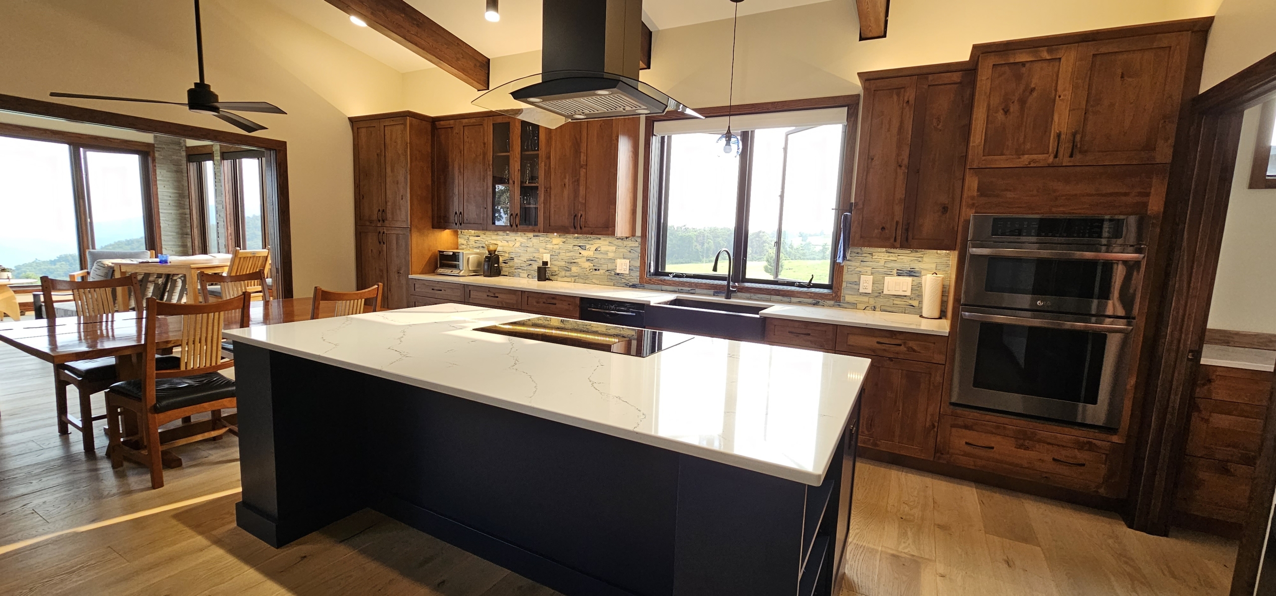 custom kitchen cabinets. Dark wood wall cabinets with blue island